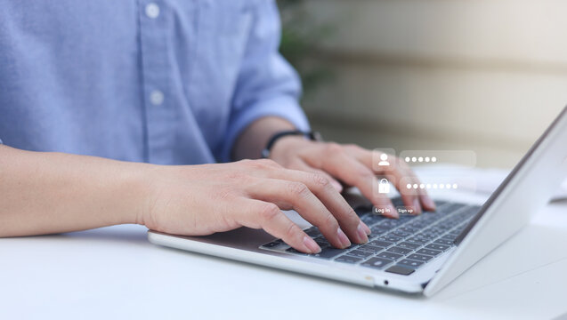 close up man hand type on laptop to access account on website by input username and password at office for security system of business technology concept