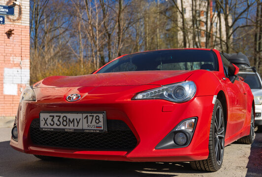 Red Japanese sport car Toyota GT86 GR Sport at the city street. Exterior of a fast Japanese two-door coupe Toyota GT 86 2.0 GR Sport  on parking lot. JDM cars. Japanese sport coupe in parking lot. 
