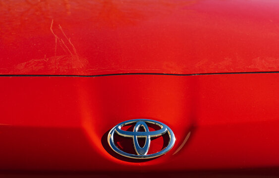 Toyota Toyota GT86 GR Sport  car in showroom. Nameplate Toyota Toyota GT86 GR on the red front bumper. Toyota Nameplate logo on the front bumper. Red Toyota Toyota GT86 GR Sport.  