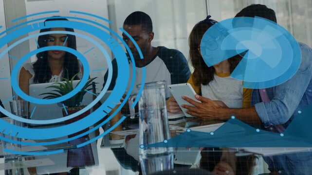 Team leaning and pointing at tablet during business review, operator scrolling data with blue HUD