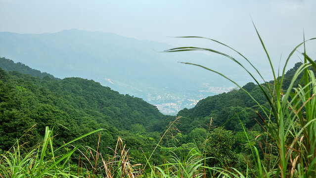 Spiral shaped condominium village, commuter enclave, uptown in the suburbs of Hong Kong. View from the mountains