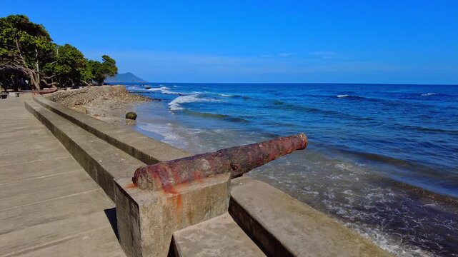 Panoramic view of the historic canyons on the Choroni boardwalk, with gentle morning waves, along the coast of Aragua, Venezuela