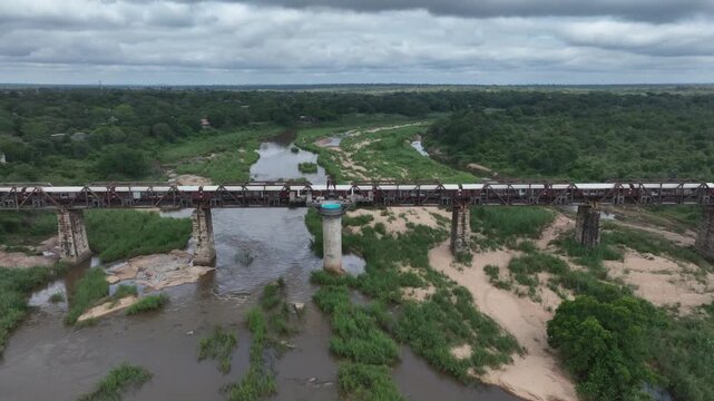 Approaching aerial drone view of Kruger Shalati The Train on the Bridge. South Africa.