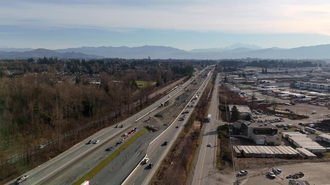 Aerial View Of Construction Work On Trans-Canada Highway Widening Project In Abbotsford, BC, Canada. descending shot