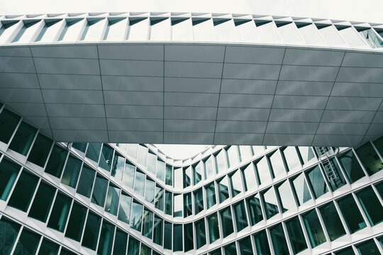 Glass atrium and roof geometry seen in wide perspective on a modern office building facade capturing architecture structure and abstract design pattern