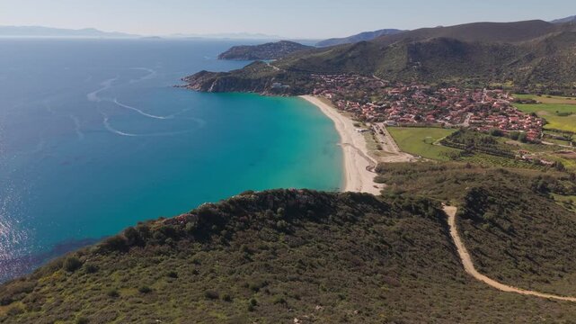 aerial drone flight discover solanas beach town coast mediterranean sea sardinia mountain nature summer vacation