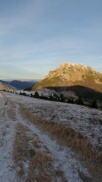 Vertical POV Walking on Frosty Mountain Ridge Toward Peak