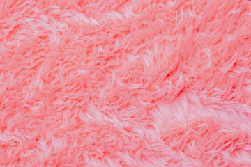 Gentle light pink fluffy textile material background showcasing cozy soft luxurious texture