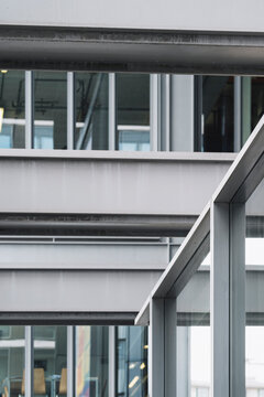 Modern architecture structure of steel and glass with beams grid facade in minimal design creating crisp industrial building detail