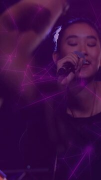 Vertical video: Female singer singing music, moving mic while purple overlay meeting intruding arm