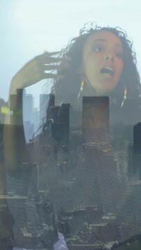 Vertical video: Lead singer starting singing skyline casting over torsos as band joining music