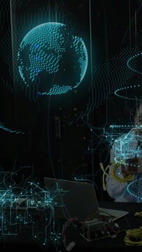 Dotted sphere appearing, tech tuning yellow cable, using PC, globe rotating over bench for testing