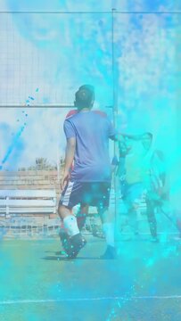 Vertical video: Soccer defender marking near goal during cross from right blue overlay obscuring