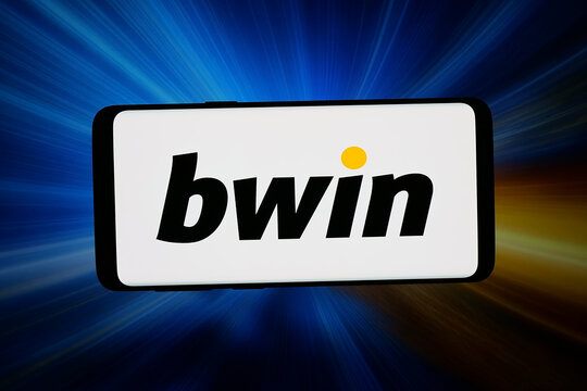 Stuttgart, Germany - 04-09-2026: In this photo illustration, the logo of sports betting company Bwin.com is displayed on a smartphone in front of abstract background on computer screen.