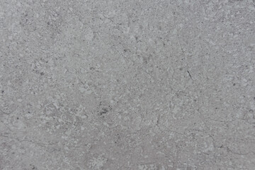 Fototapeta premium Light gray rough textured surface with subtle patterns and natural variations throughout
