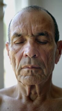 Senior Man with Real Skin Textures Meditating in Natural Light