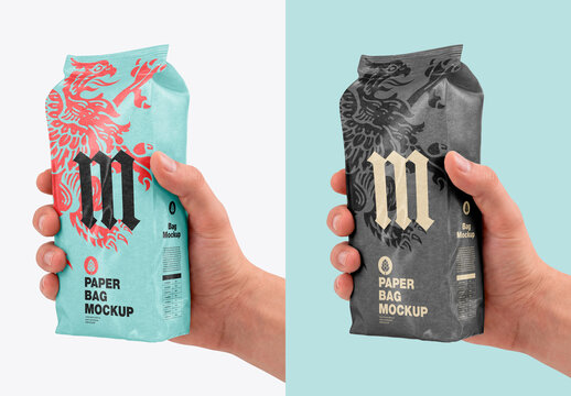 Hand holding blank silver pouch packaging mockup isolated on clean background