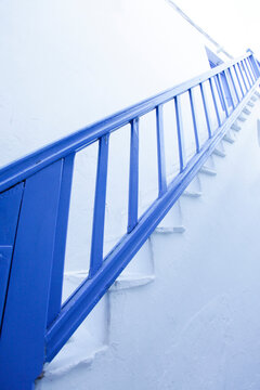 Minimal blue staircase railing with clean lines modern architectural design