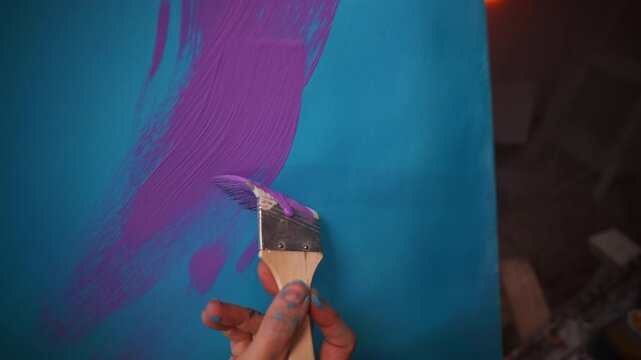Bright Coloration On Textured Canvas. Closeup Of Artist Applying Thick Acrylic Paint