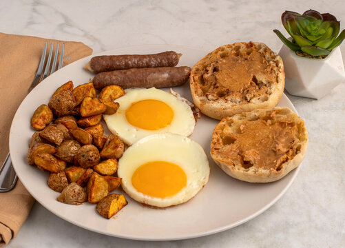 fried eggs with  sausage and home fries
