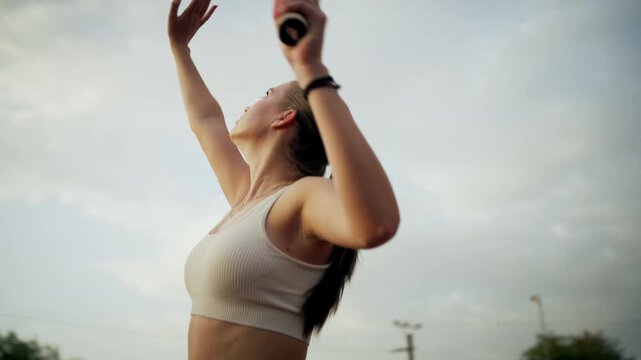 Female Tennis Player Perfects Serve On Detailed Clay Court Surface