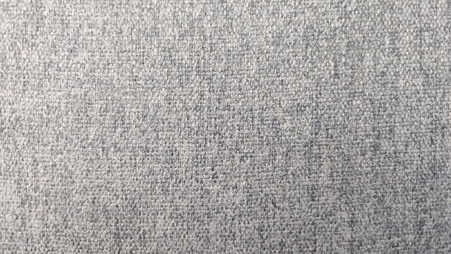 Texture of light gray decorative upholstery furniture material with a clear weave arranged in parallel