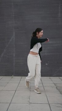 Talented female dancer performing afrobeat and hip hop dance