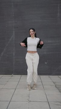 Young woman dancing hip hop and afrobeat on the street