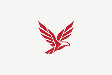 Red geometric flying eagle logo for modern esports team and technology brand identity © creativediastudio