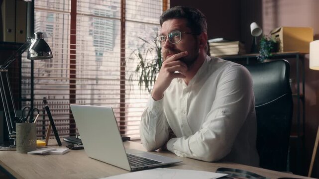 Pensive Caucasian business man working laptop in office thinking decision businessman thoughtful male manager agent search idea online contemplating problem solving tech sales planning strategy indoor