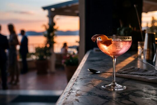 Lucien Gaudin Cocktail with Sunset Water View