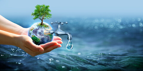 Earth Day - Hands Holding Earth with Faucet And Drop Water In Blue Sea With Defocused Lights -...