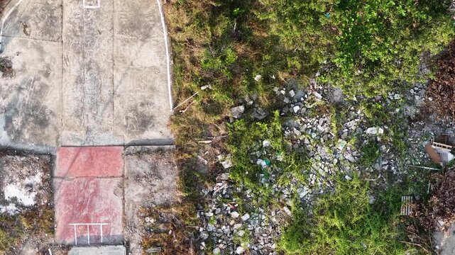 Aerial drone view of dilapidated building site and rubble
