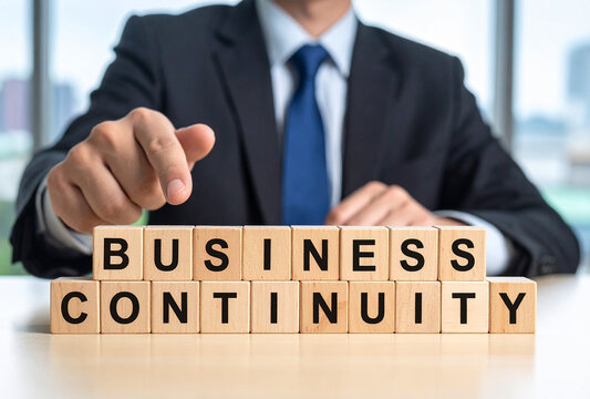 Business continuity - Geschäftsmann zeigt auf den Text "Business continuity"
