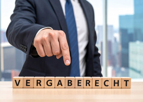 Vergaberecht - Geschäftsmann zeigt auf den Text "Vergaberecht"