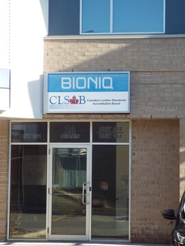 Nepean, Ontario, Canada &ndash; July 27, 2025: The entrance to 28 Deakin Street in features signage for BIONIQ and the "Canadian Lumber Standards Accreditation Board."

