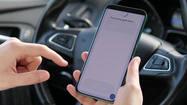 Applying for citizenship via smartphone in a car. Close-up of person using a mobile app to submit immigration documents and pay fees. Concept of modern e-government services, digital bureaucracy, and