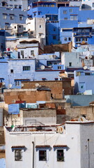 Fototapeta premium Overhead view of buildings on a slope in the medina in Chefchaouen, Moroccco