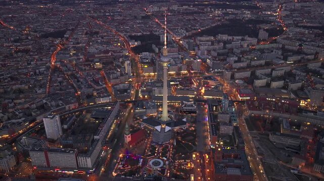 Christmas market in Berlin, Germany, Alexanderplatz at Winter Night, Aerial. Illuminated Weihnachtsmarkt in Berlin-mitte