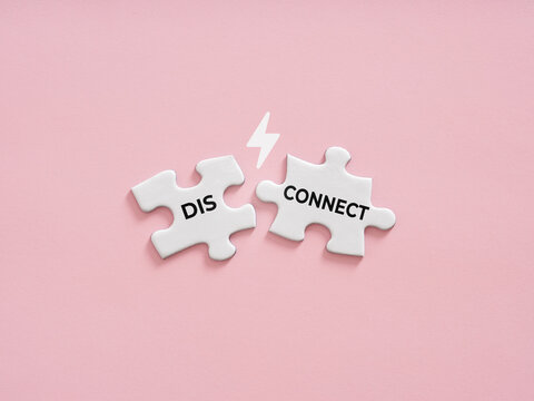 Disconnecting puzzle pieces symbolizing relationship breakup and conflict