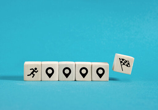 Runner reaching final goal on wooden blocks