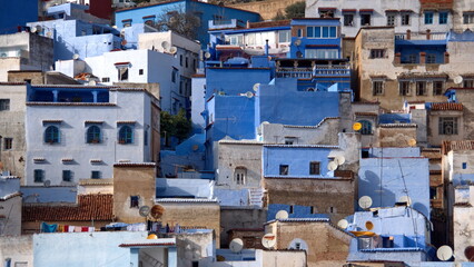 Fototapeta premium Overhead view of buildings on a slope in the medina in Chefchaouen, Moroccco