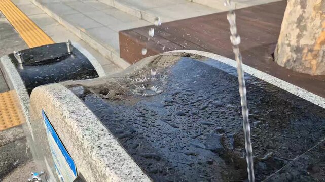 8K UHD Fresh Clean Water Flowing from Chrome Faucet for Hygiene Concept