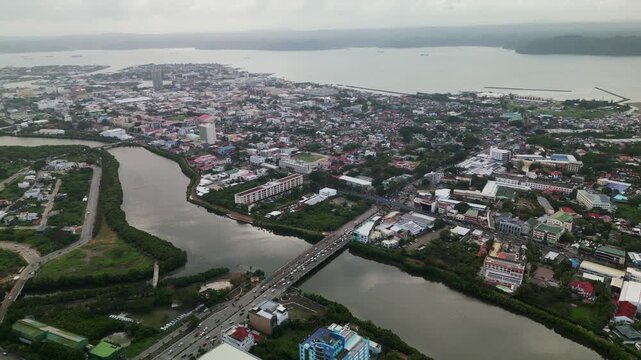 Iconic Bridge Across Iloilo River And Iloilo Esplanade In The Philippines. Aerial Shot
