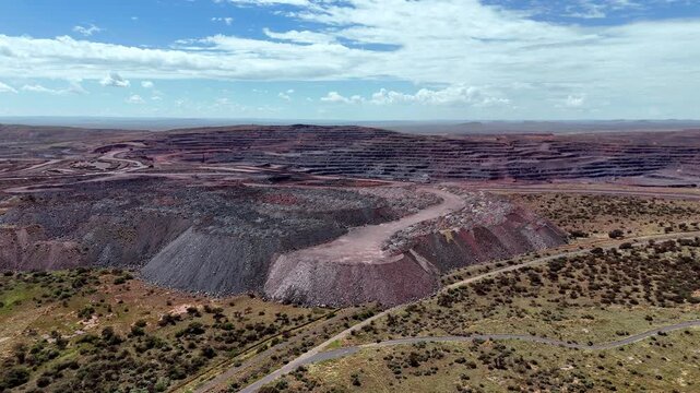 Aerial approach toward unsightly waste rock dumped in heaps from open-cast mine