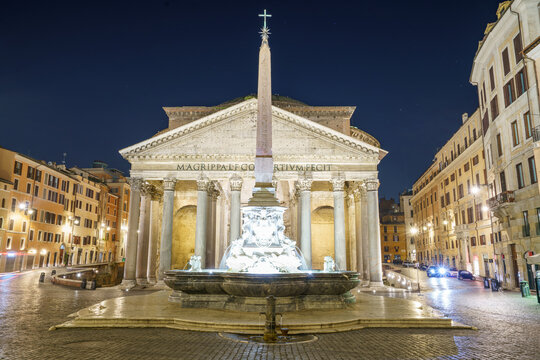 Fontanna Panteonu and obelisk with writing in pyramidion language "Pharaoh Ramses II"  in front of Pantheon at night. Rome
