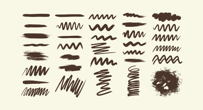 Set of dark brown hand-drawn ink brush strokes, zigzags and paint splatters on cream background.