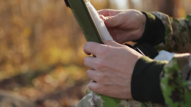 First aid kit. Forest. Man's hands. Slow motion video. . High quality 4k footage