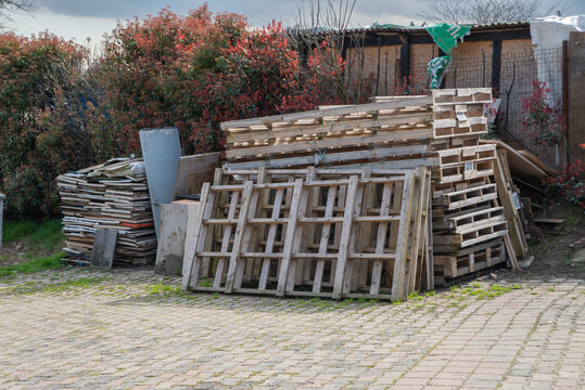 Wooden broken pallets in warm cloudy day