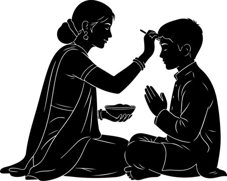 Mother applying tika to son during indian festival.